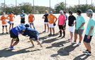  ミーティングで動作の確認をする合同チームの選手ら＝松江市西生馬町、松江工業高等専門学校