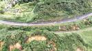 斜面が崩れ、路面の亀裂や歩道の崩落が生じた国道９号＝出雲市多伎町小田（出雲市消防本部提供）